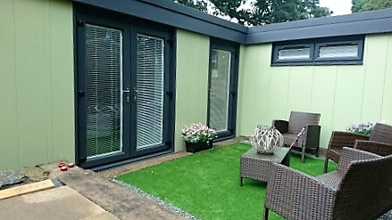 Two bedroom Granny Annexe with anthracite windows and fascia with moorland green leather grain embossed galvanised steel.