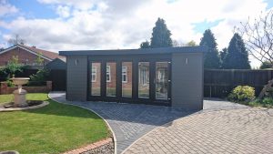 Large Grey Garden Office with Block-paving